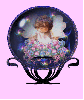Angel girl in snowglobe with flowers